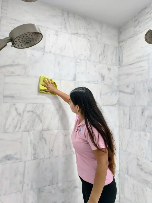 Edis cleaner at work — marble walls wiped spotless