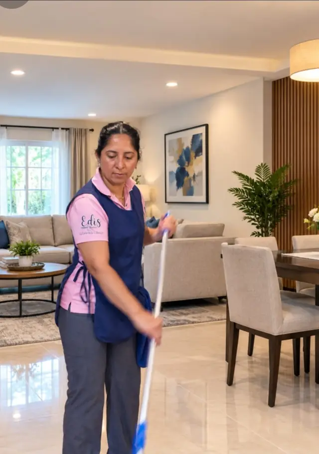 Cleaner mopping a tile floor in a move-out home